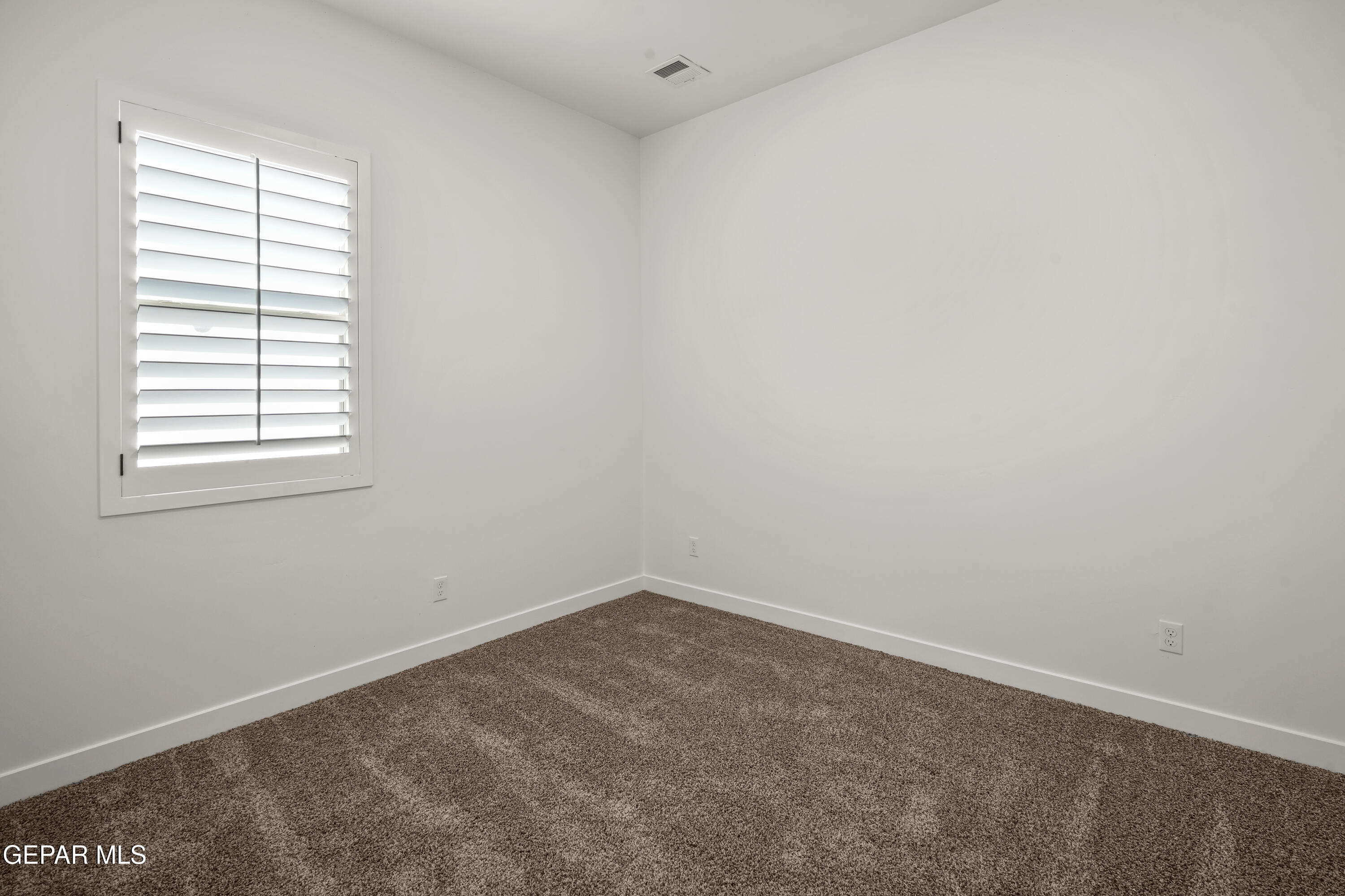 15224 Resolve El Paso, TX 79938 - Photo 6 of 38 an empty room with a window
