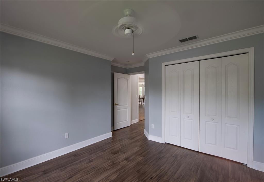 9229 Lanthorn Way Estero, FL 33928 - Photo 15 of 41 wooden floor in an empty room with a window