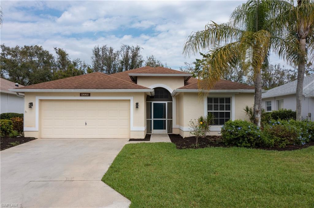 9229 Lanthorn Way Estero, FL 33928 - Photo 2 of 41 a front view of a house with garden