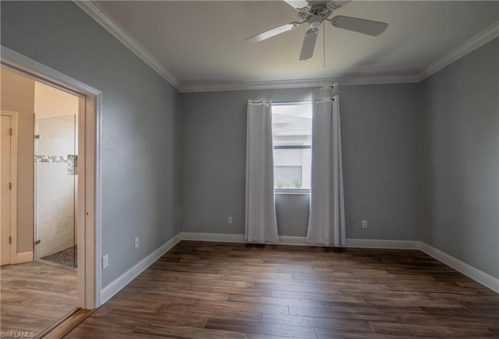 9229 Lanthorn Way Estero, FL 33928 - Photo 23 of 41 a view of an empty room with wooden floor and a window
