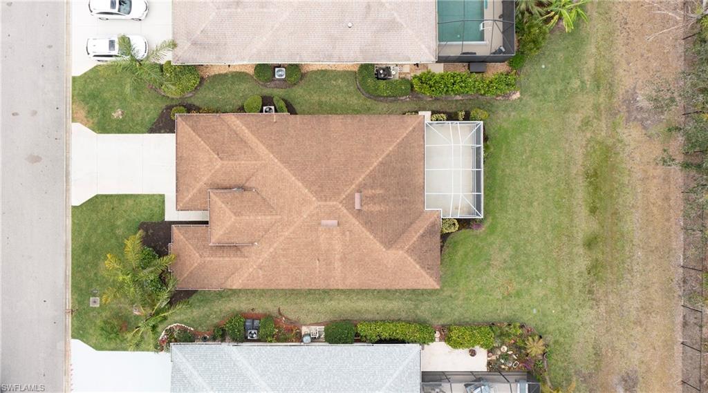 9229 Lanthorn Way Estero, FL 33928 - Photo 29 of 41 an aerial view of a house with a yard and garden