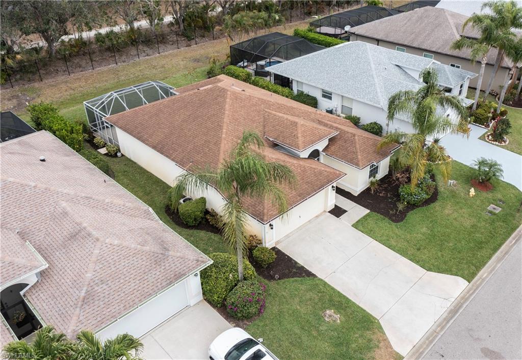 9229 Lanthorn Way Estero, FL 33928 - Photo 30 of 41 an aerial view of house with outdoor space and lake view
