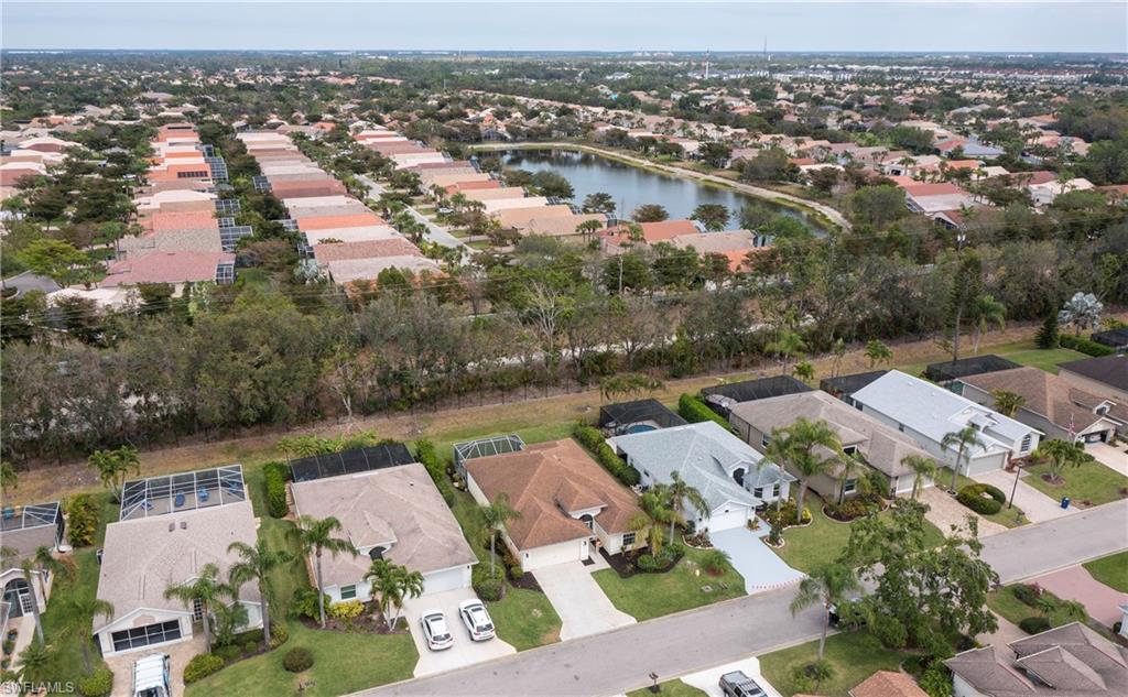 9229 Lanthorn Way Estero, FL 33928 - Photo 32 of 41 an aerial view of a city with lots of residential buildings