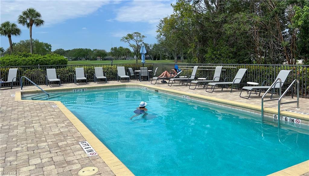 9229 Lanthorn Way Estero, FL 33928 - Photo 36 of 41 a view of a swimming pool with a patio and a garden