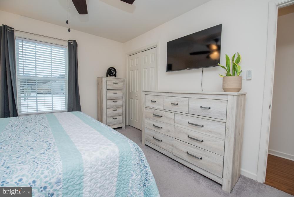 17180 Philips Hill Road Laurel, DE 19956 - Photo 24 of 65 a bedroom with a bed a flat screen tv and a window