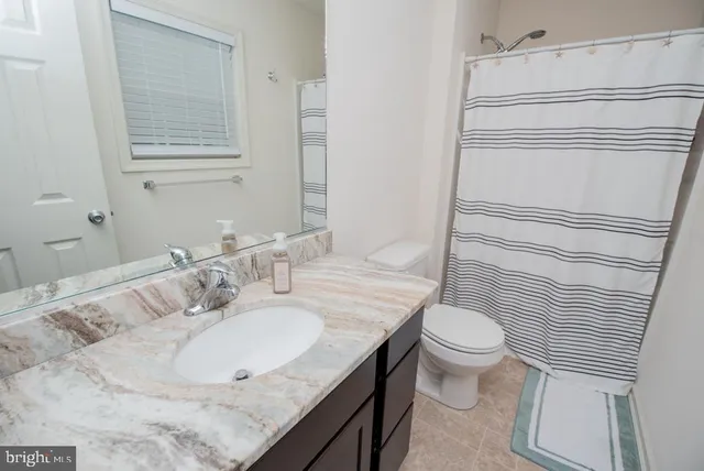 a bedroom with a bed and a table