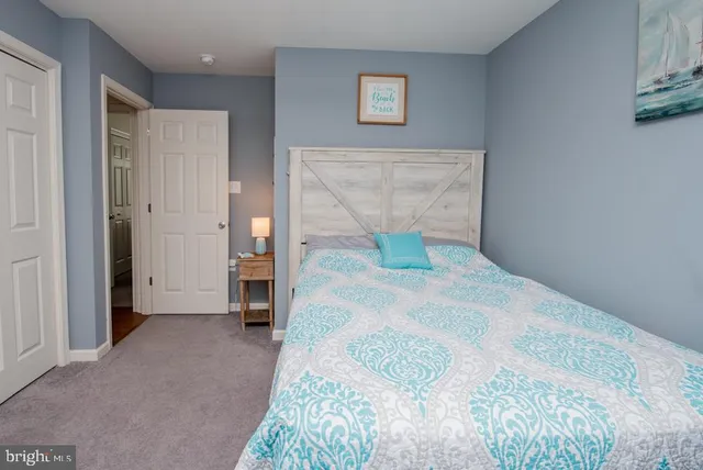 a bedroom with a bed and a desk