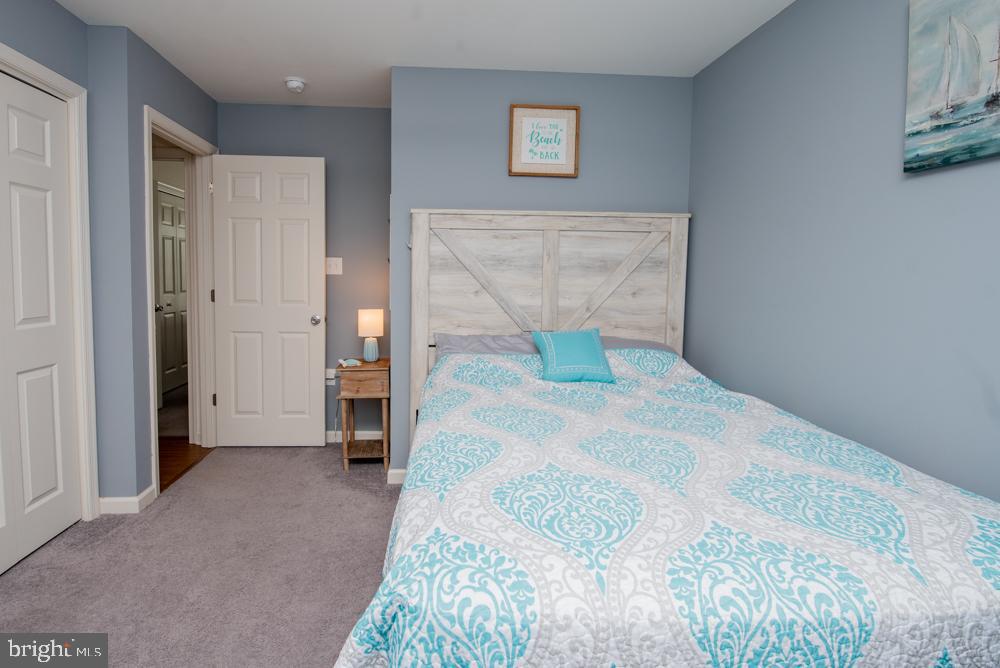 17180 Philips Hill Road Laurel, DE 19956 - Photo 27 of 65 a bedroom with a bed and a table