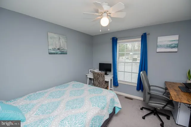 a bedroom with a bed and a table in it