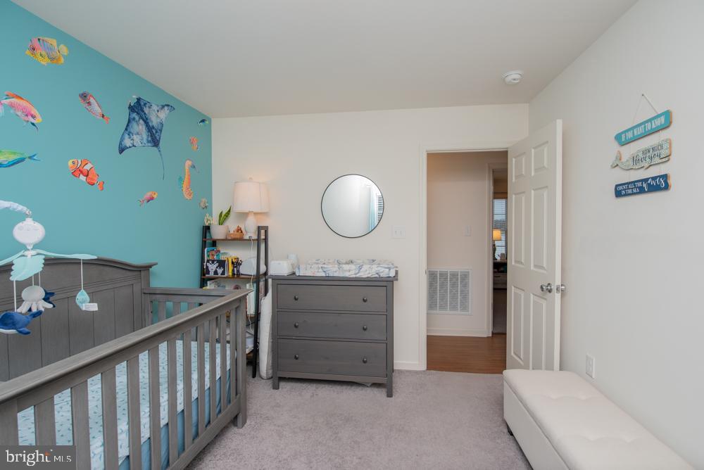 17180 Philips Hill Road Laurel, DE 19956 - Photo 34 of 65 a spacious bedroom with a bed and a dresser