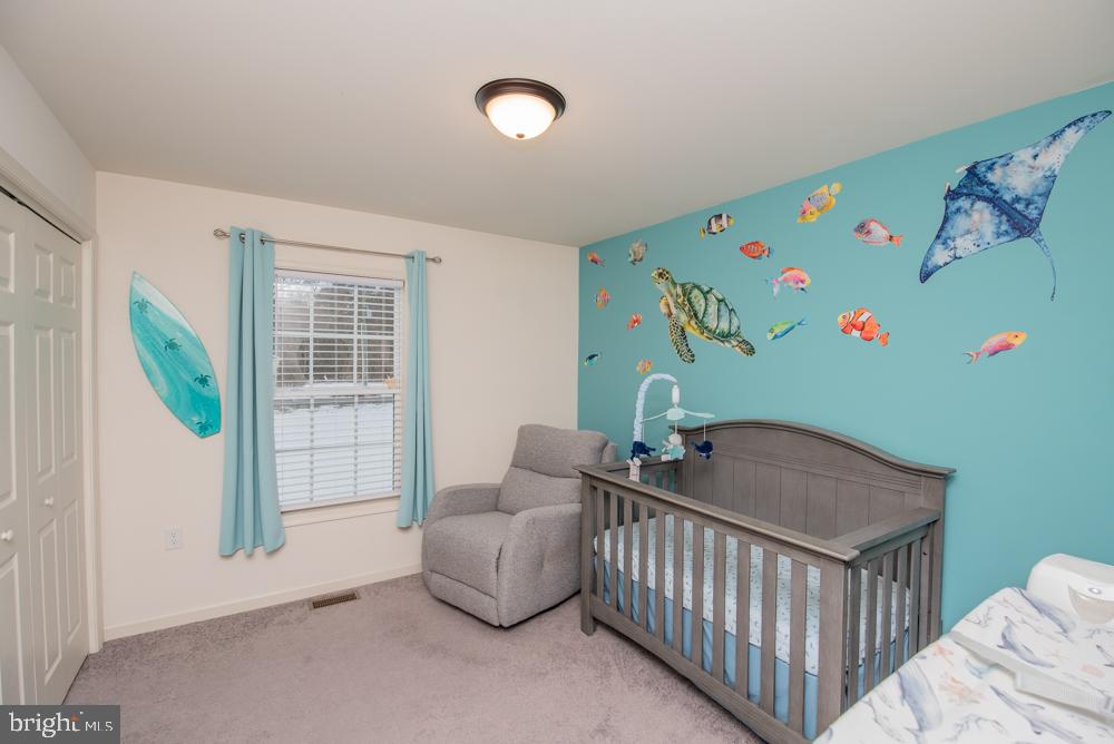 17180 Philips Hill Road Laurel, DE 19956 - Photo 36 of 65 a bedroom with a bed and a window