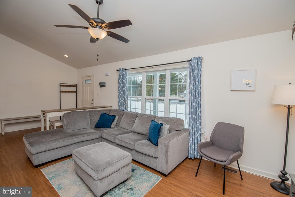 17180 Philips Hill Road Laurel, DE 19956 - Photo 4 of 65 a living room with furniture and a large window