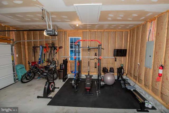 a front view of a house with a yard and a garage