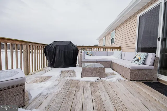 a view of a dry yard with a house in the background