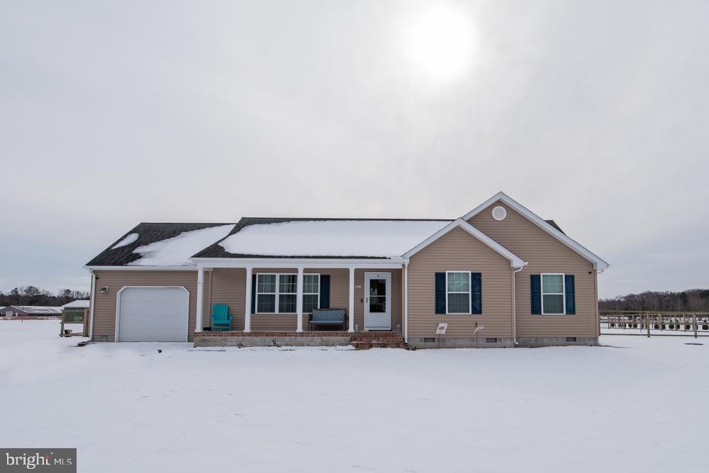 17180 Philips Hill Road Laurel, DE 19956 - Photo 60 of 65 a front view of a house with a yard and garage