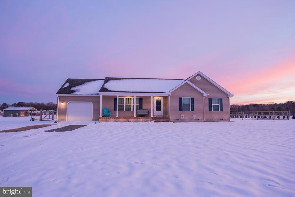 17180 Philips Hill Road Laurel, DE 19956 - Photo 63 of 65 a front view of a house with a yard and a garage