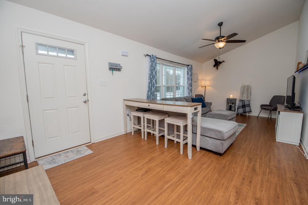17180 Philips Hill Road Laurel, DE 19956 - Photo 8 of 65 a living room with furniture and a wooden floor