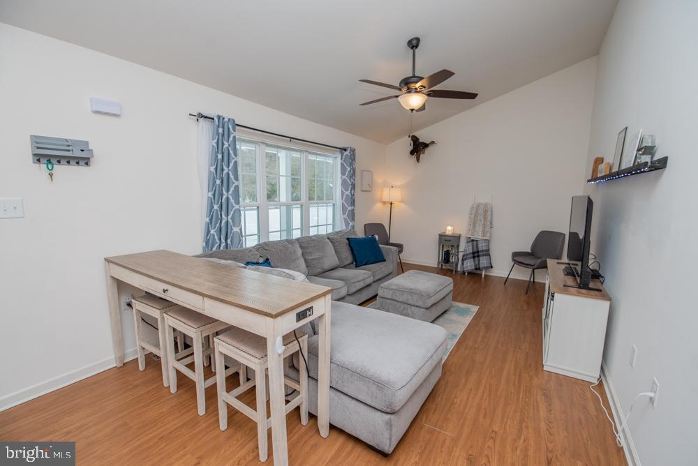 17180 Philips Hill Road Laurel, DE 19956 - Photo 9 of 65 a view of a dining room with furniture window and wooden floor