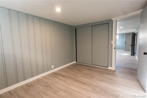 a view of hallway with wooden floor