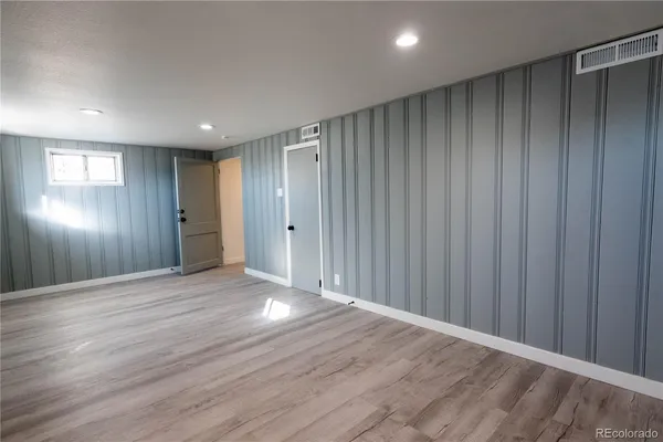 a view of hallway with wooden floor