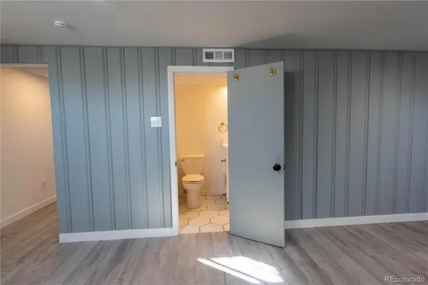 a view of bathroom with a sink and a mirror