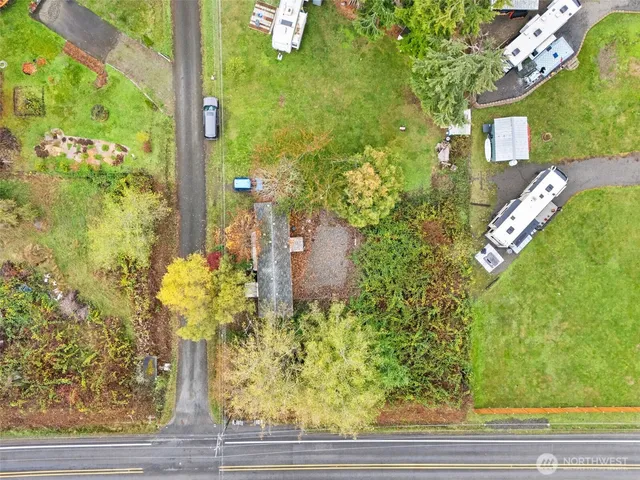 a white table with chairs and a stove