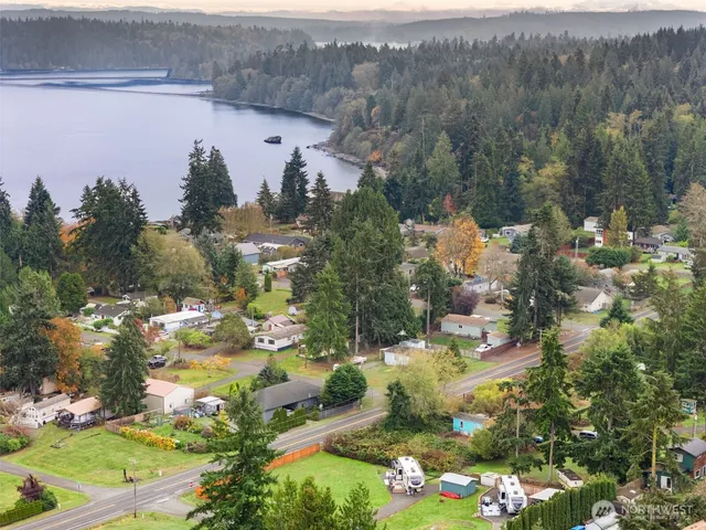 a view of a lake with a table and chairs