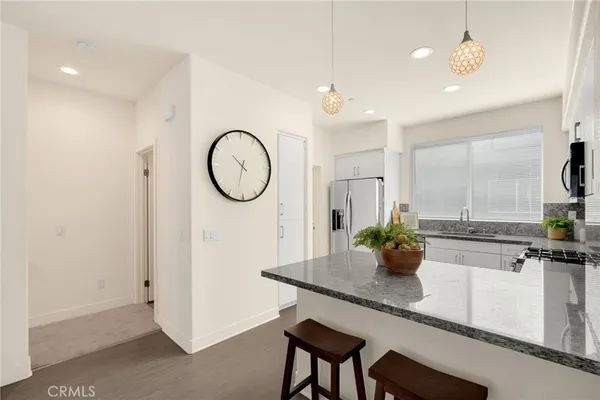 a kitchen with a table and chairs in it