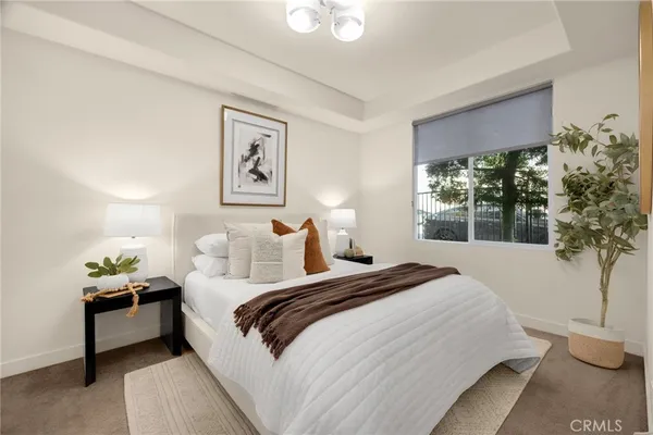 a bedroom with bed and a window