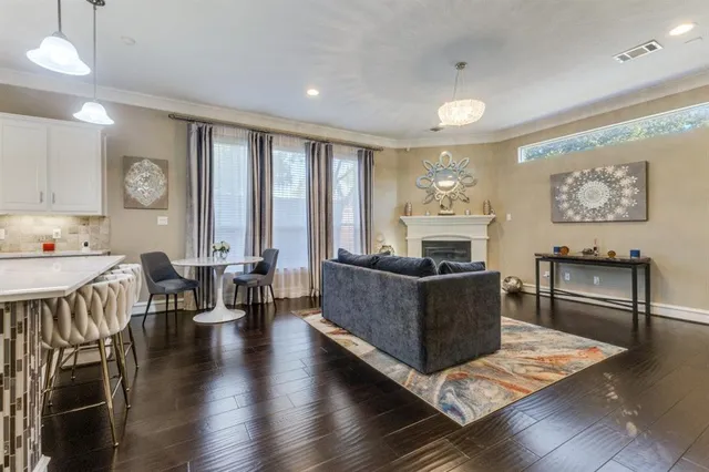 a large kitchen with a table and chairs