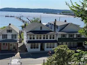 a front view of a house with street view