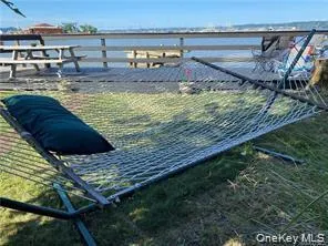 a view of a backyard with sitting area