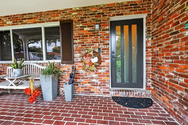 a view of a house with a yard porch and sitting area