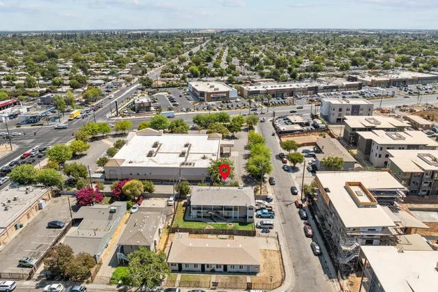 an aerial view of residential houses with outdoor space