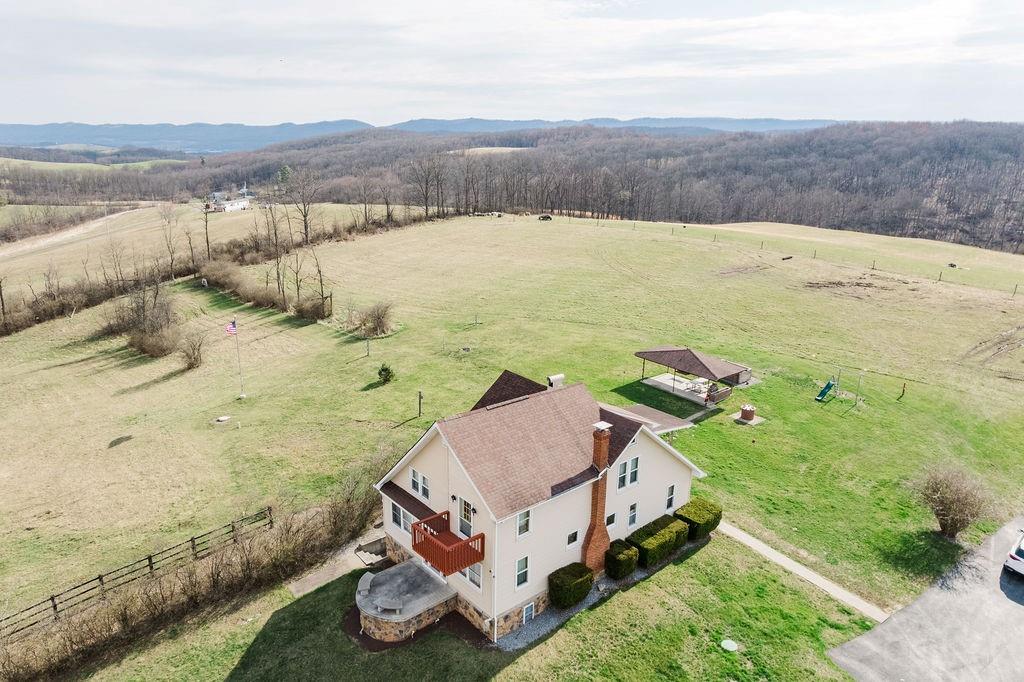 1898 Schellsburg Road Claysburg, PA 16625 - Photo 20 of 50 Front of home showing expansive farmland with electrified fencing.