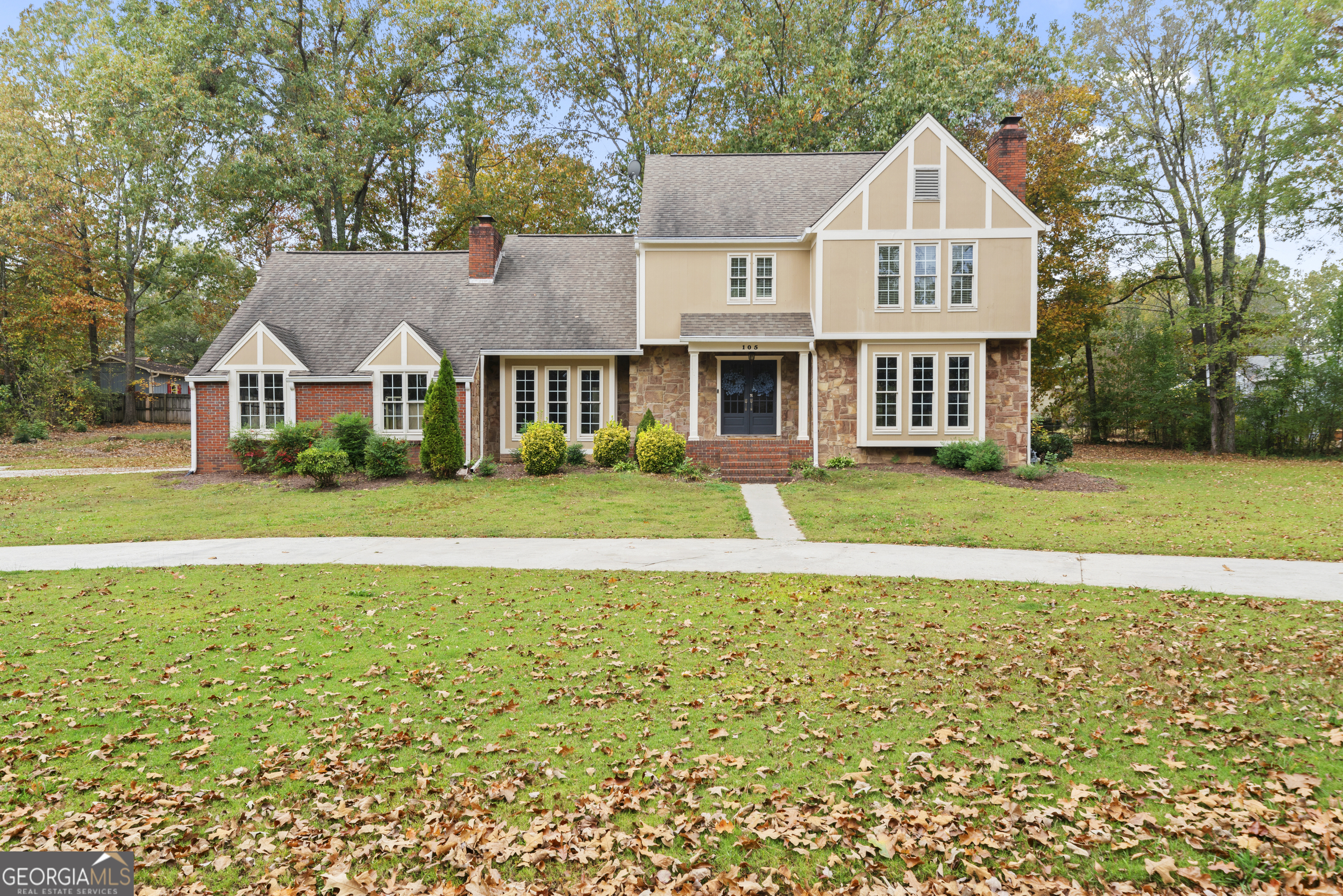 105 Windwood Way Rome, GA 30165 - Photo 1 of 1 a front view of a house with a yard