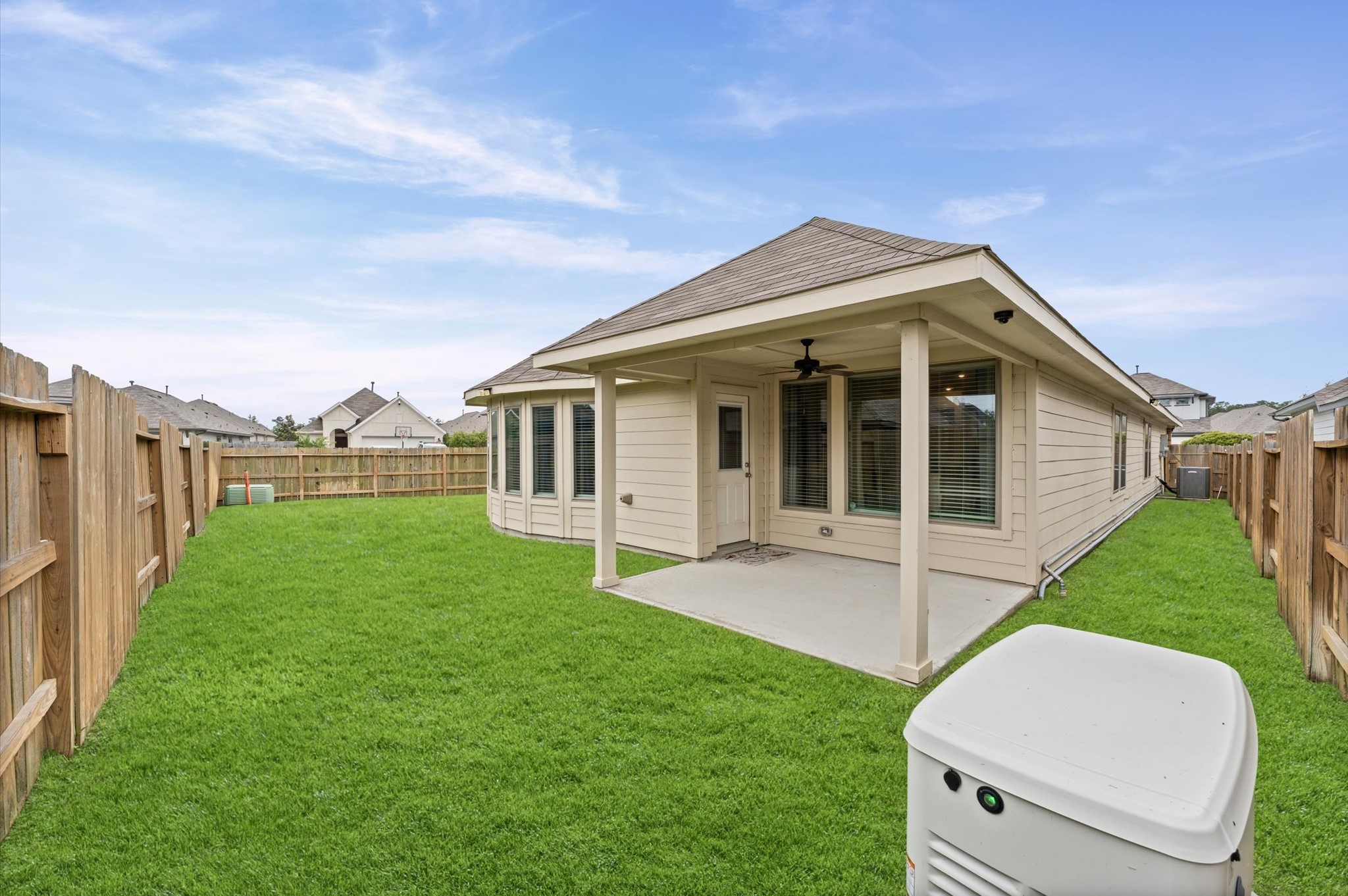 2702 Meadow View Lane Conroe, TX 77385 - Photo 20 of 26 a view of a house with a backyard