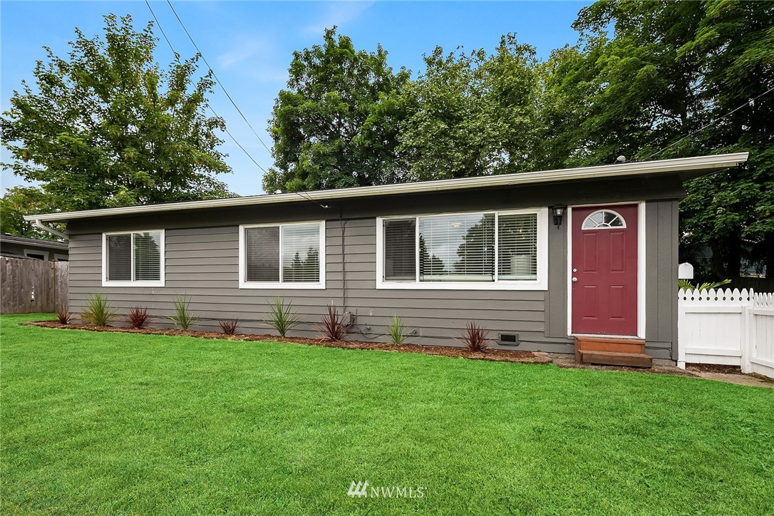 2613 Northeast 7th Street Renton, WA 98056 - Photo 1 of 23 a front view of house with yard and green space