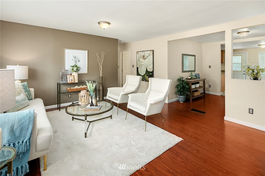 2613 Northeast 7th Street Renton, WA 98056 - Photo 2 of 23 a living room with furniture and wooden floor