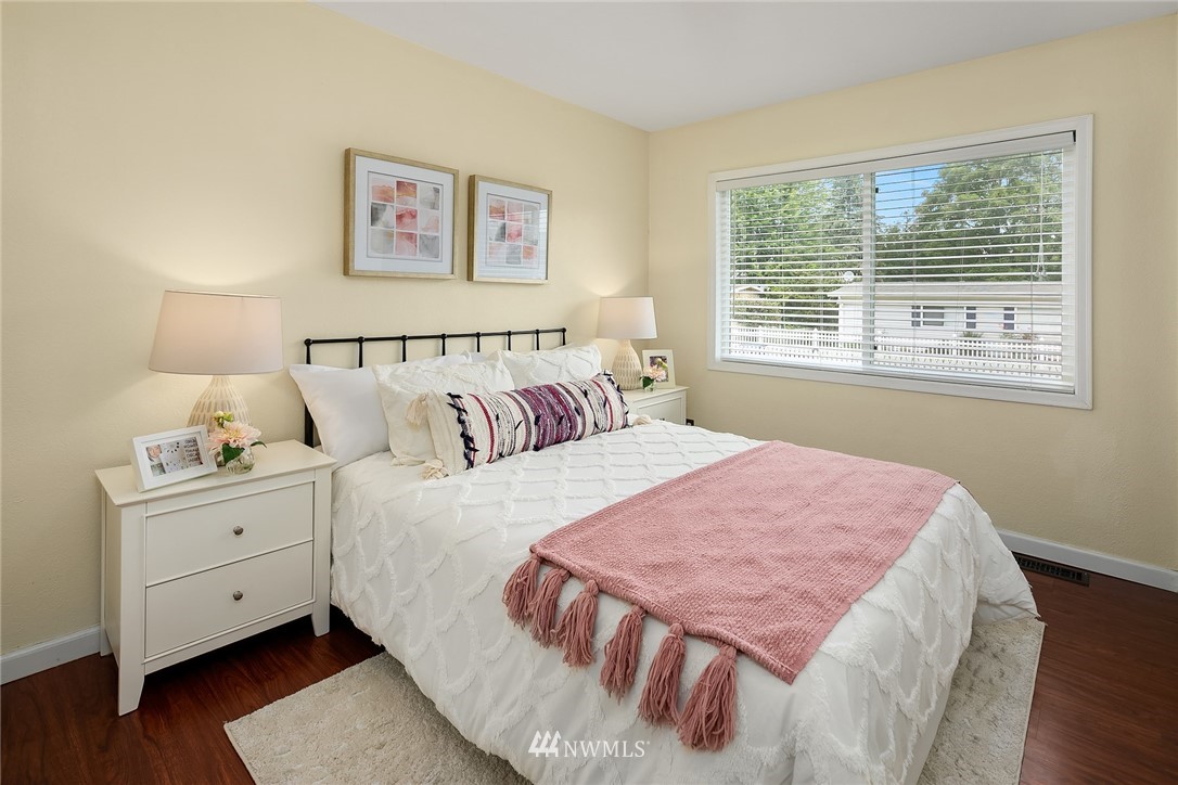2613 Northeast 7th Street Renton, WA 98056 - Photo 15 of 23 a bedroom with a bed and a window