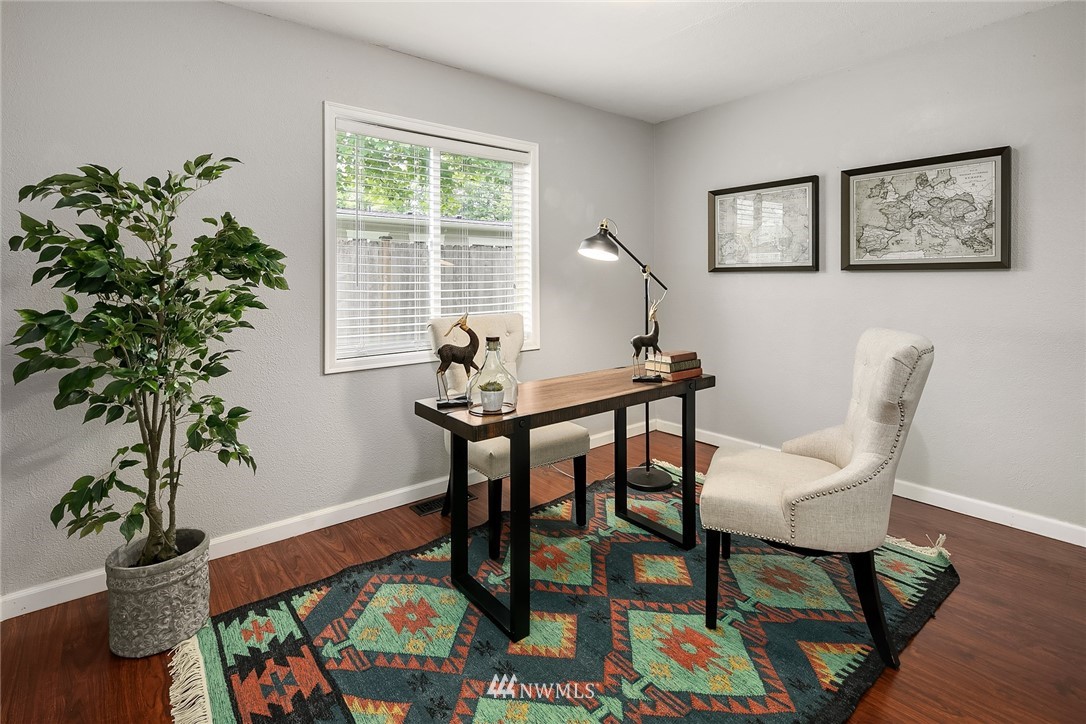 2613 Northeast 7th Street Renton, WA 98056 - Photo 16 of 23 a view of a dining room with furniture window and wooden floor