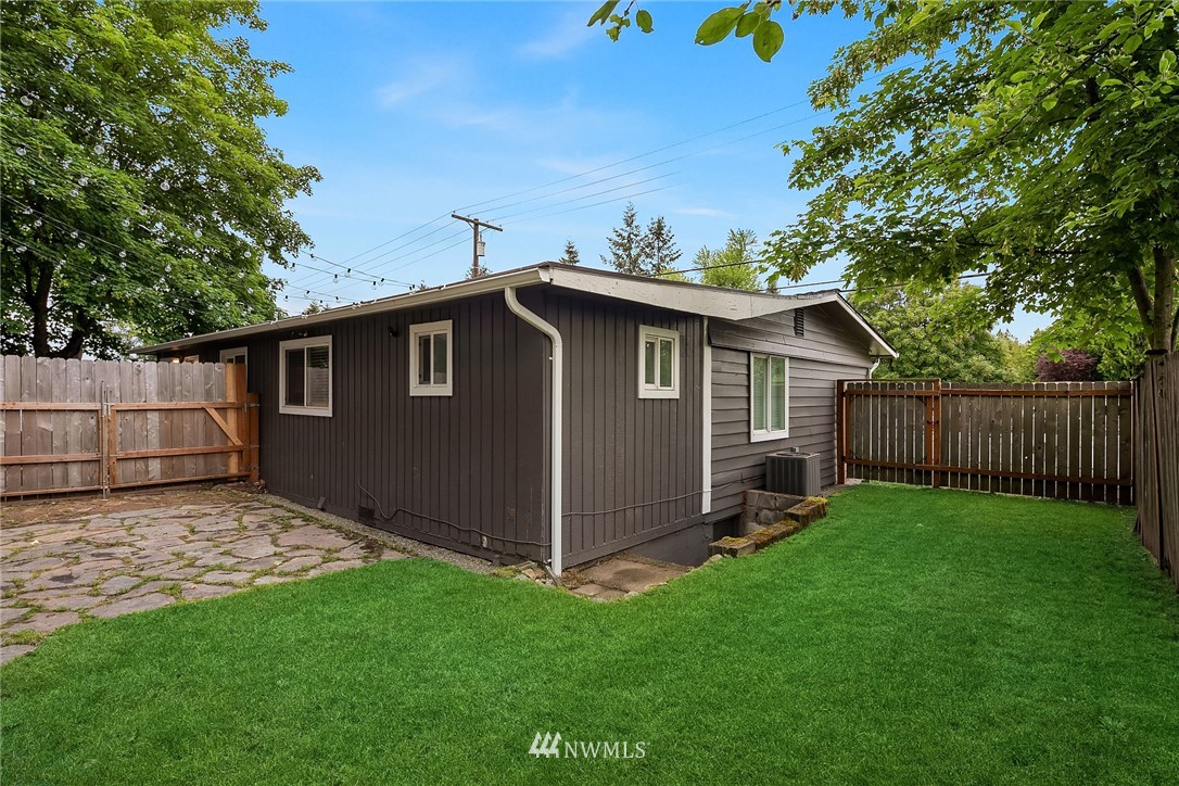 2613 Northeast 7th Street Renton, WA 98056 - Photo 20 of 23 a backyard of a house with lots of green space