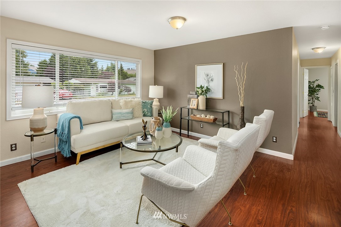 2613 Northeast 7th Street Renton, WA 98056 - Photo 3 of 23 a living room with furniture and a large window