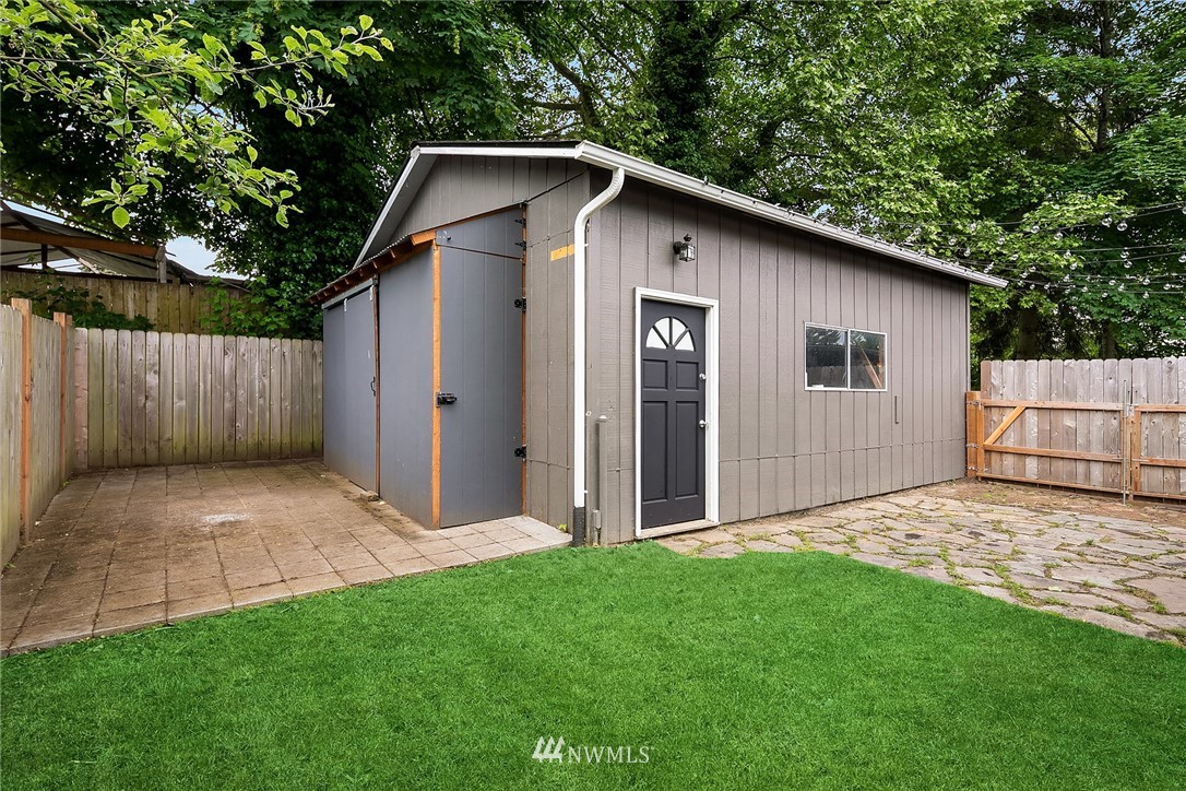 2613 Northeast 7th Street Renton, WA 98056 - Photo 21 of 23 a view of backyard of house with wooden fence