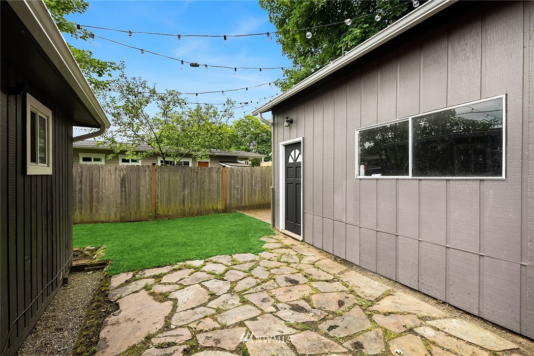2613 Northeast 7th Street Renton, WA 98056 - Photo 22 of 23 a backyard of a house with lots of green space