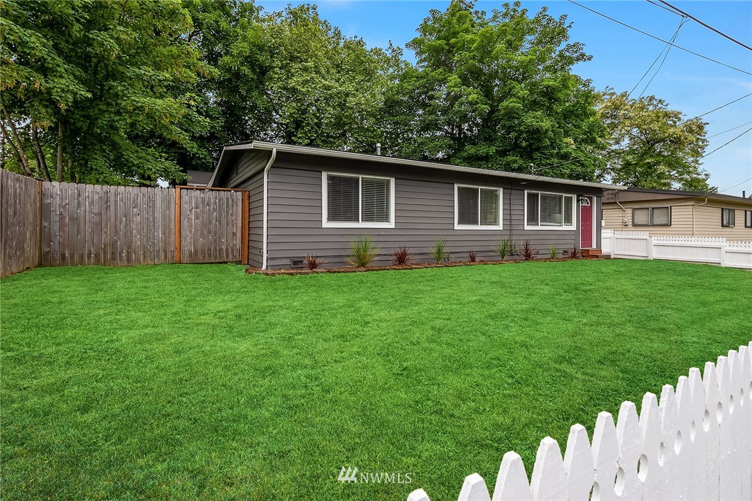 2613 Northeast 7th Street Renton, WA 98056 - Photo 23 of 23 a backyard of a house with lots of green space