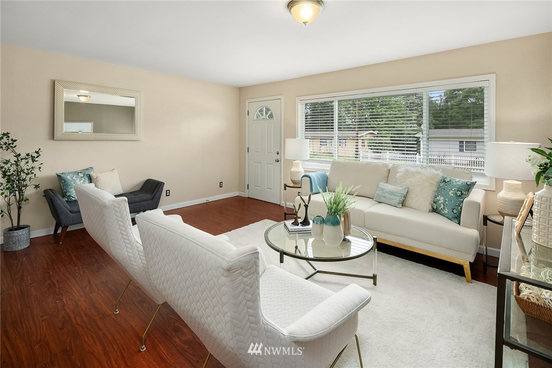 2613 Northeast 7th Street Renton, WA 98056 - Photo 4 of 23 a living room with furniture and a large window