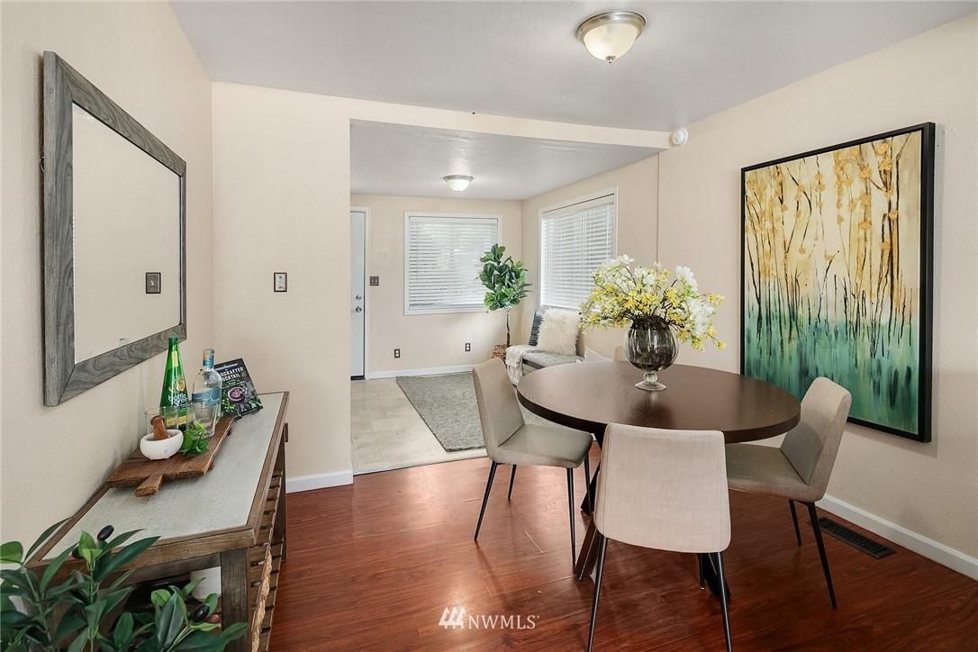 2613 Northeast 7th Street Renton, WA 98056 - Photo 5 of 23 a view of a dining room with furniture window and wooden floor