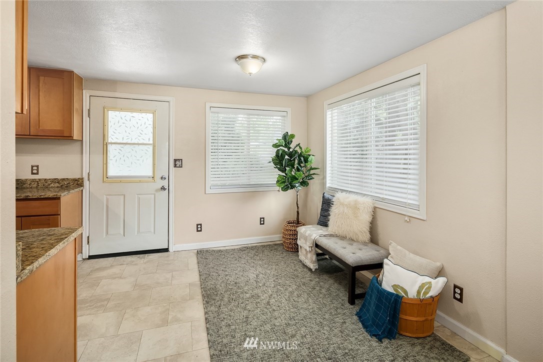 2613 Northeast 7th Street Renton, WA 98056 - Photo 7 of 23 a living room with furniture and a large window