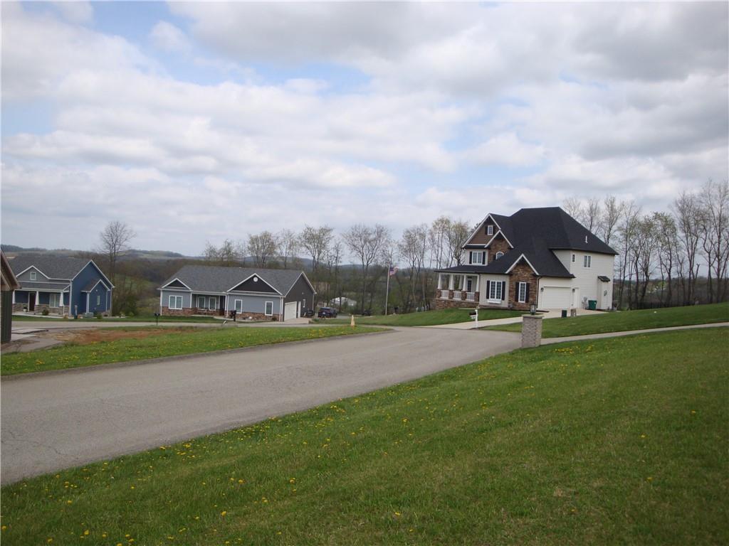 765 Victoria Way Derry, PA 15627 - Photo 2 of 5 a view of a green field with house in the background